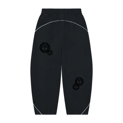 Black athletic jogger pants with white curved contrast stitching and black globe graphics on the legs, shown against a plain white background.